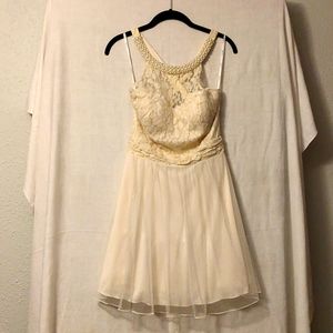 Ivory Cocktail Dress Jr SZ 9 Hi Neck Criss Cross Back